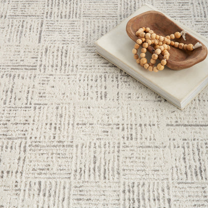 Tapis abstrait gris ivoire Nourison Emily pour l'intérieur uniquement