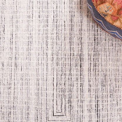 Tapis en laine moderne abstrait fait main SAFAVIEH Maggy