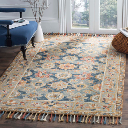 Tapis en laine à pompons Boho Aspen Kimm fait main SAFAVIEH