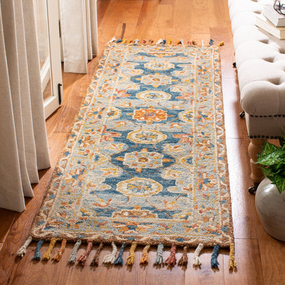Tapis en laine à pompons Boho Aspen Kimm fait main SAFAVIEH