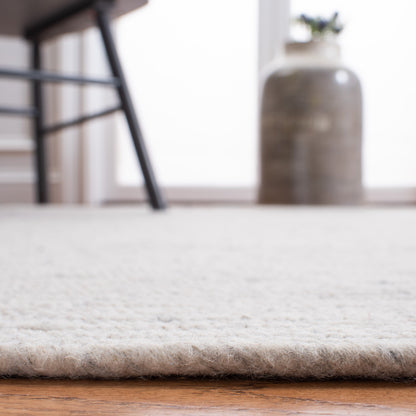 Tapis de campagne en laine tressée à la main SAFAVIEH