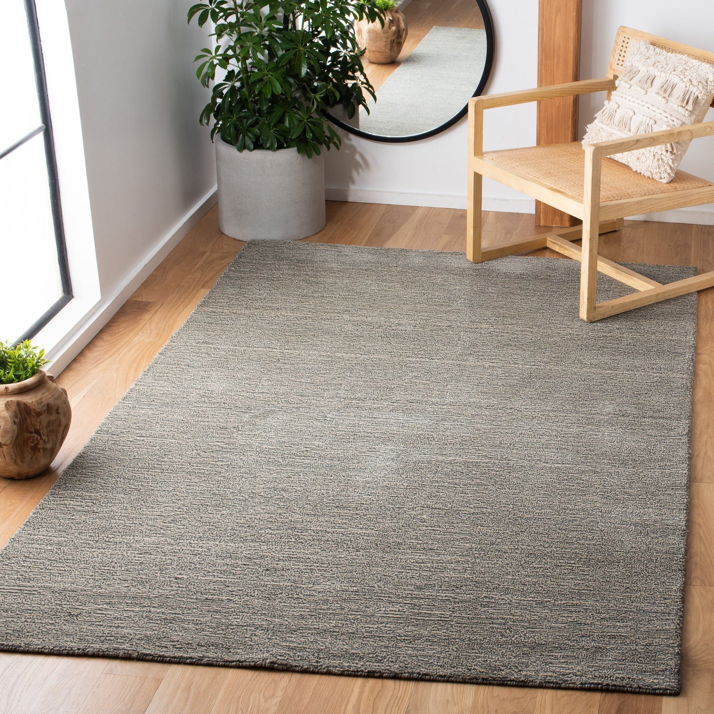 Tapis moderne en laine fait main SAFAVIEH avec bordure en palmier de l'Himalaya