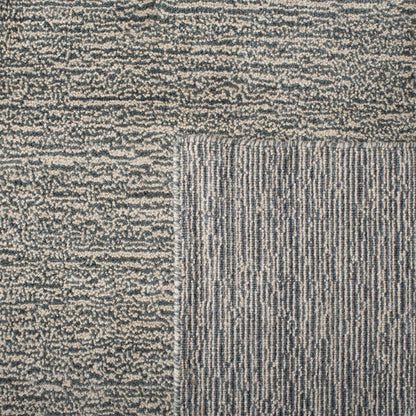 Tapis moderne en laine fait main SAFAVIEH avec bordure en palmier de l'Himalaya