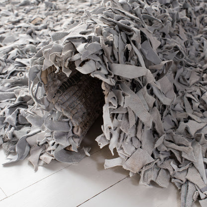 Tapis décoratif moderne en cuir fait main SAFAVIEH Shag Doinita