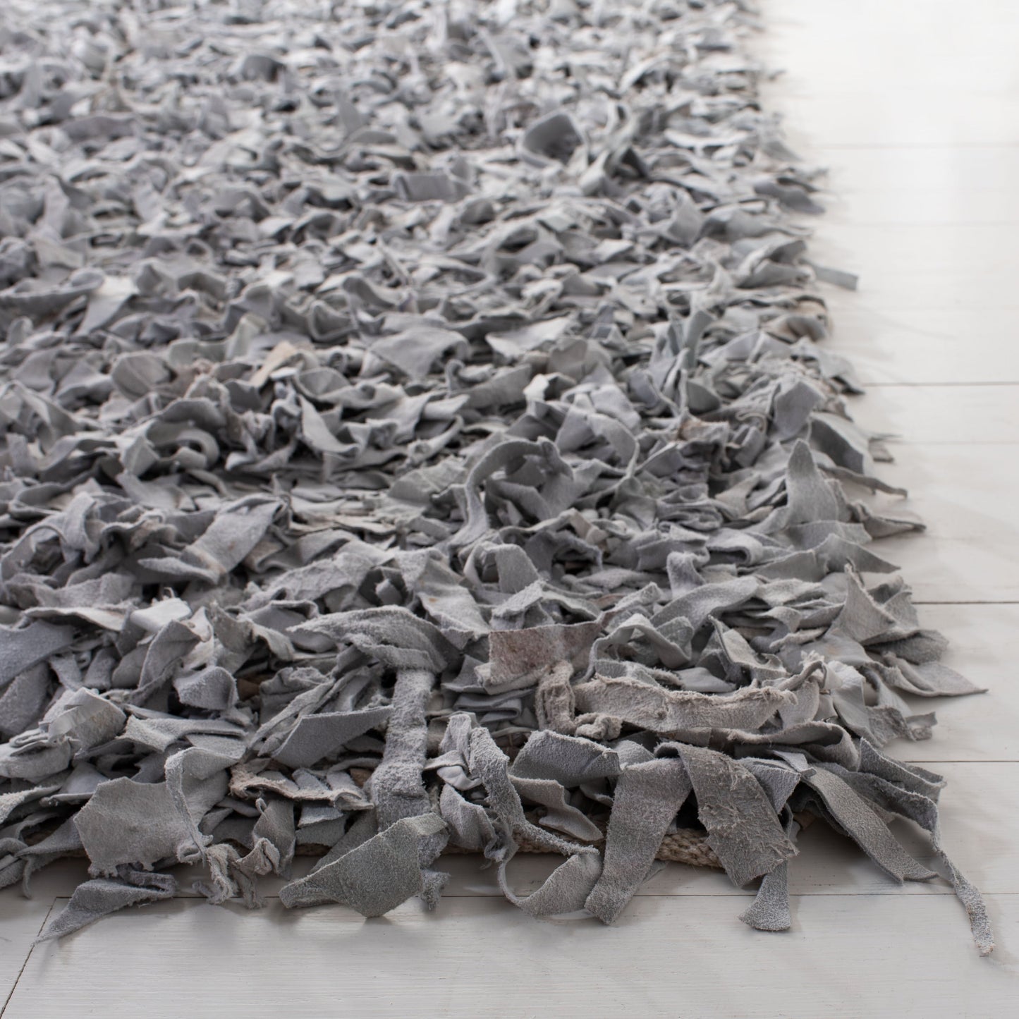 Tapis décoratif moderne en cuir fait main SAFAVIEH Shag Doinita